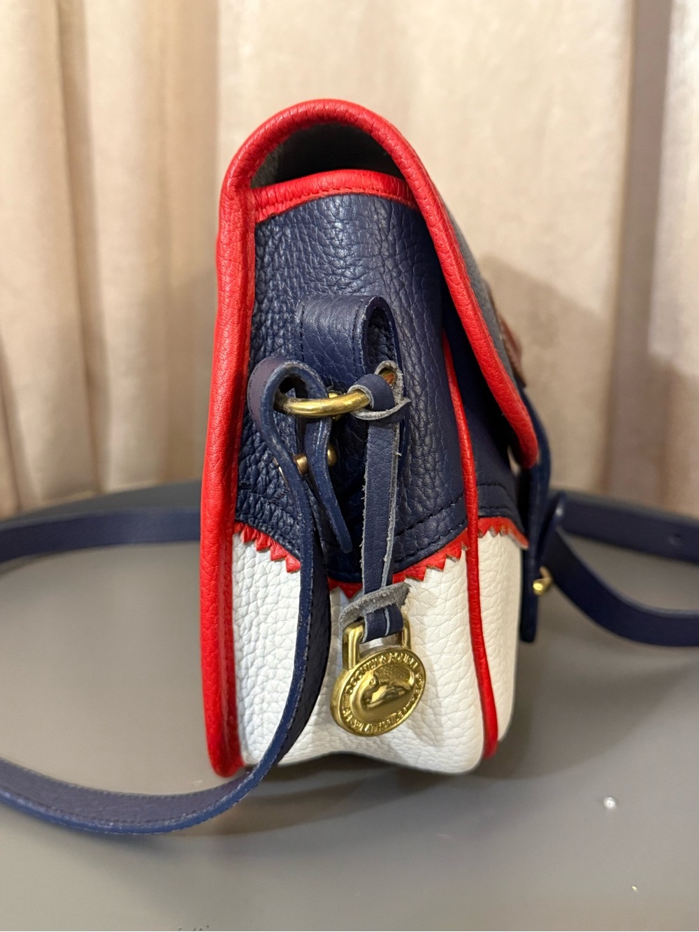 Dooney & Bourke Navy, White & Red Pebble Leather Crossbody Saddle Bag - Picture 3 of 8